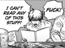 a man is reading a book while sitting at a table with food .