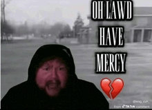 a man in a hooded jacket says " oh lawd have mercy " in front of a broken heart