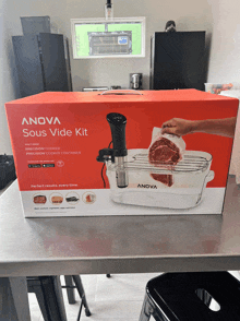 a sous vide kit from anova sits on a stainless steel table