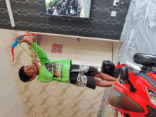 a young boy playing with a toy bow and arrow