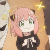 a girl with pink hair and green eyes is smiling with a dog in the background