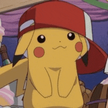 a pikachu wearing a red hat is standing in a crowd of people .