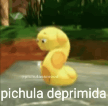 a yellow cartoon character is sitting on the ground with the words pichula deprimida written on it .