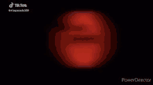 a close up of a red circle in the dark .