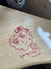 a drawing of spongebob and the words sponge jojo seaweed on a table