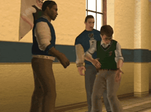 a man in a blue shirt with a shield on it stands next to two other men