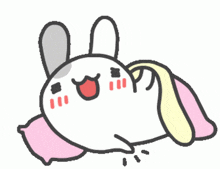 a cartoon rabbit laying on a pink pillow