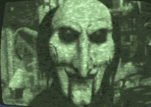 a green and black image of a monster on a television