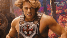 a man in a masters of the universe costume with a shield on his chest