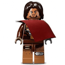 a lego man with a beard is wearing a red cape and holding a gun .