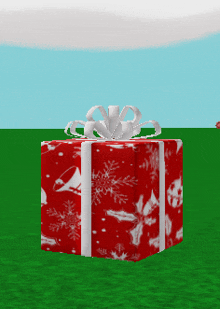 a red and white gift box with a white bow on top