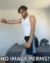 a man is standing on a bed with his arms outstretched and the words `` no image permits '' .