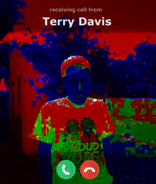 a man is receiving a call from terry davis who is wearing a proud roots shirt