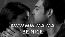 a man and woman are kissing in a black and white photo with the words `` awww ma ma be nice '' .