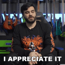 a man with a beard wearing a shirt that says revv on it