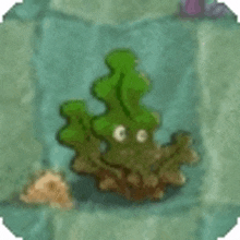 a cartoon coral with eyes is sitting on a rock in the water .