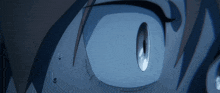 a close up of a person 's eye with tears coming out of it