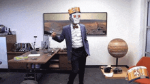 a man in a suit and bow tie is dancing in front of a painting of mars