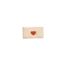 a white envelope with a red heart stamped on it