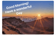 a picture of a mountain with the words good morning have a wonderful day on it