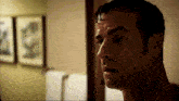 a close up of a man 's face in a room