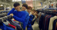 a group of young men are posing for a picture in a store