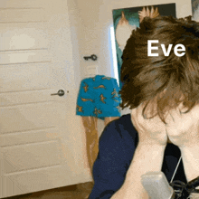 a person covering their face with their hands with the word eve written on their hair