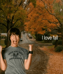 a boy wearing a shirt that says rock and roll high school on it