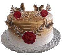 a white and gold cake with red roses and butterflies