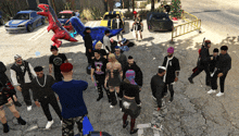 a group of people are gathered in a parking lot with a t-shirt that says ' i love you ' on it