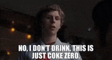 a man is saying `` no , i don 't drink . this is just coke zero . '' .