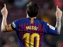 a soccer player wearing a jersey that says messi 10