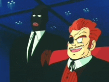 a man with red hair is smiling next to a man in a black mask