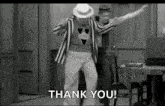 a black and white photo of a man dancing in a room with the words `` thank you '' .