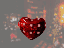 a red heart with a drawing of a boy and a santa hat on it