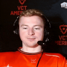 a man wearing headphones and a red shirt that says craig