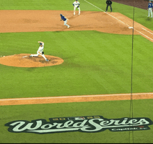 a baseball game is being played on a field that says world series on it