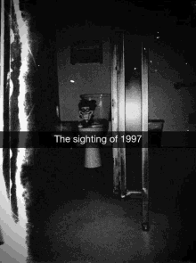 a black and white photo of a toilet with the sighting of 1997 written below it