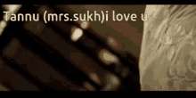 tannu ( mrs.sukh ) i love u is written on the screen