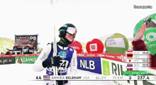 annika belshaw usa is standing in front of a banner that says nlb