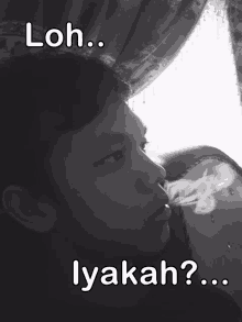 a black and white photo of a man smoking with the words loh lyakah below him