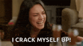a woman is laughing and says `` i crack myself up ! ''