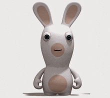 a white cartoon rabbit with big eyes and a brown spot on his chest