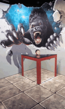 a painting of a gorilla with sharp claws on a wall behind a table