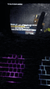 a video game is being played on a laptop with a purple keyboard