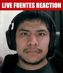 a man wearing headphones with the words live fuentes reaction on the bottom