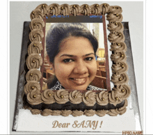 a cake with a picture of a woman and the words " dear sany "