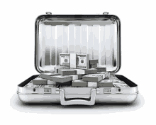 a silver briefcase is filled with stacks of money .