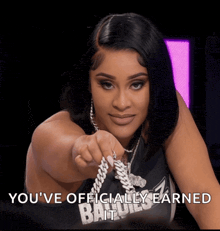 a woman wearing a shirt that says " you 've officially earned it "