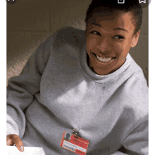 a woman wearing a name tag with the name washington on it smiles